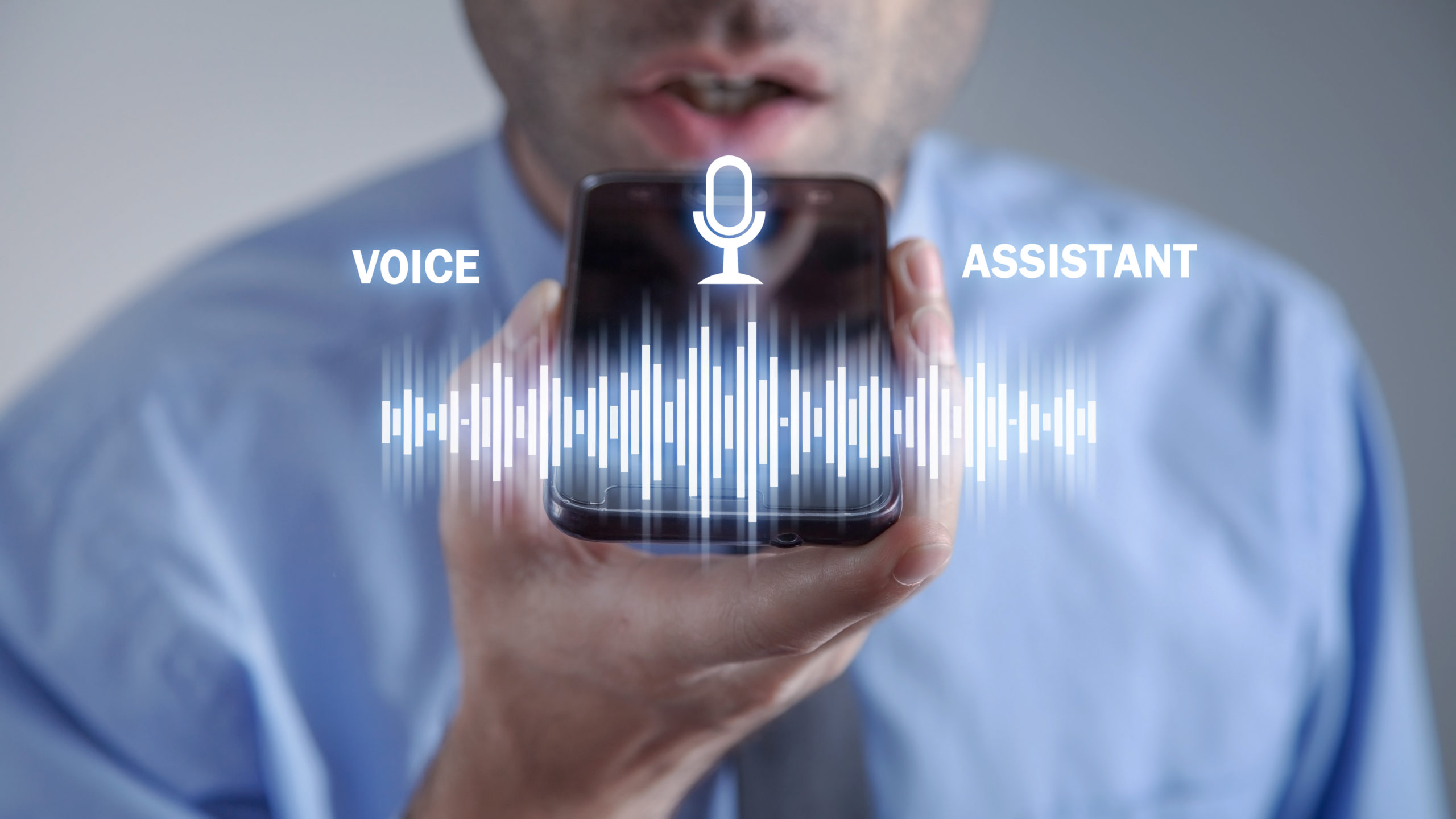 man-using-smartphone-voice-assistant-for-voice-search-optimization
